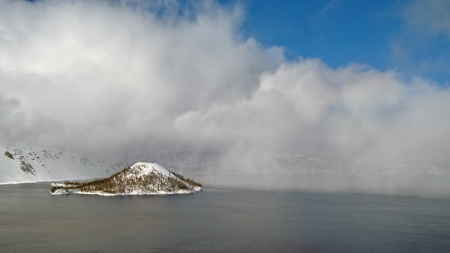 A snow squall moves across the surface of Crater Lake.