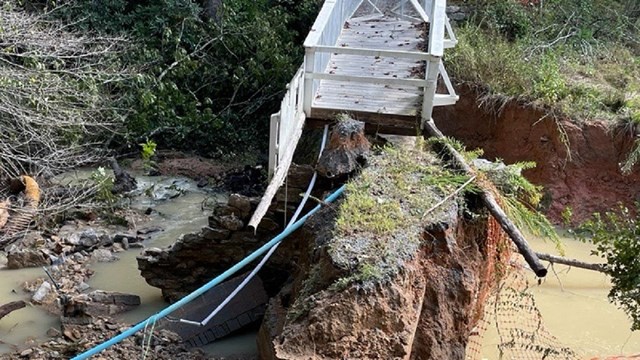 Collapsed wooden bridge with support equipment