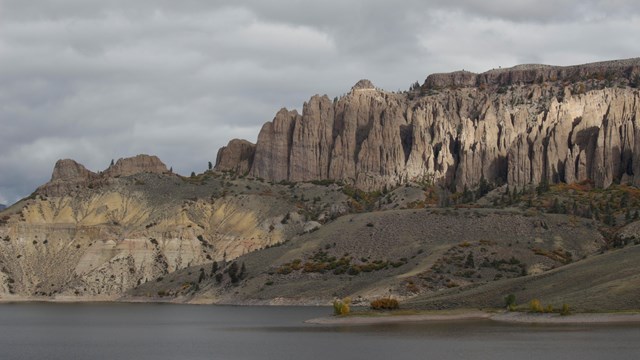 Tall geologic pinnacles on the side of a mesa