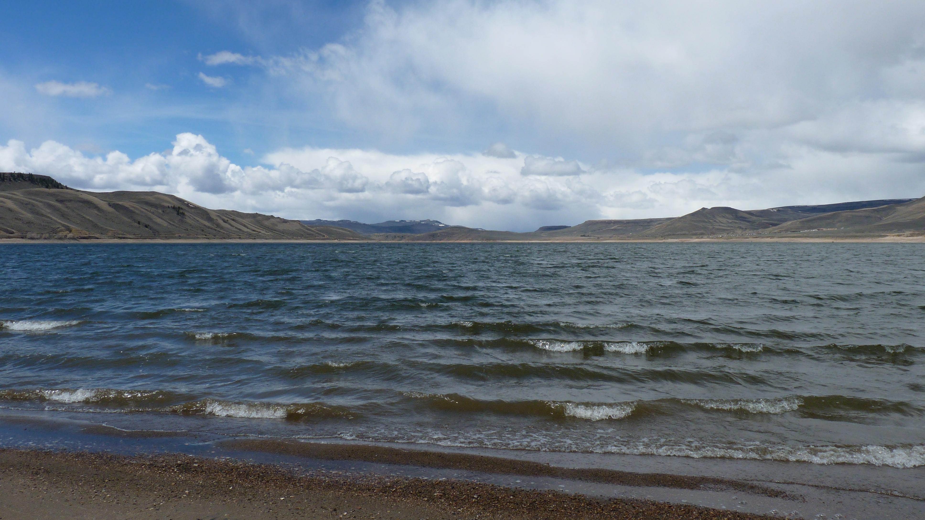 A reservoir with waves on a shore