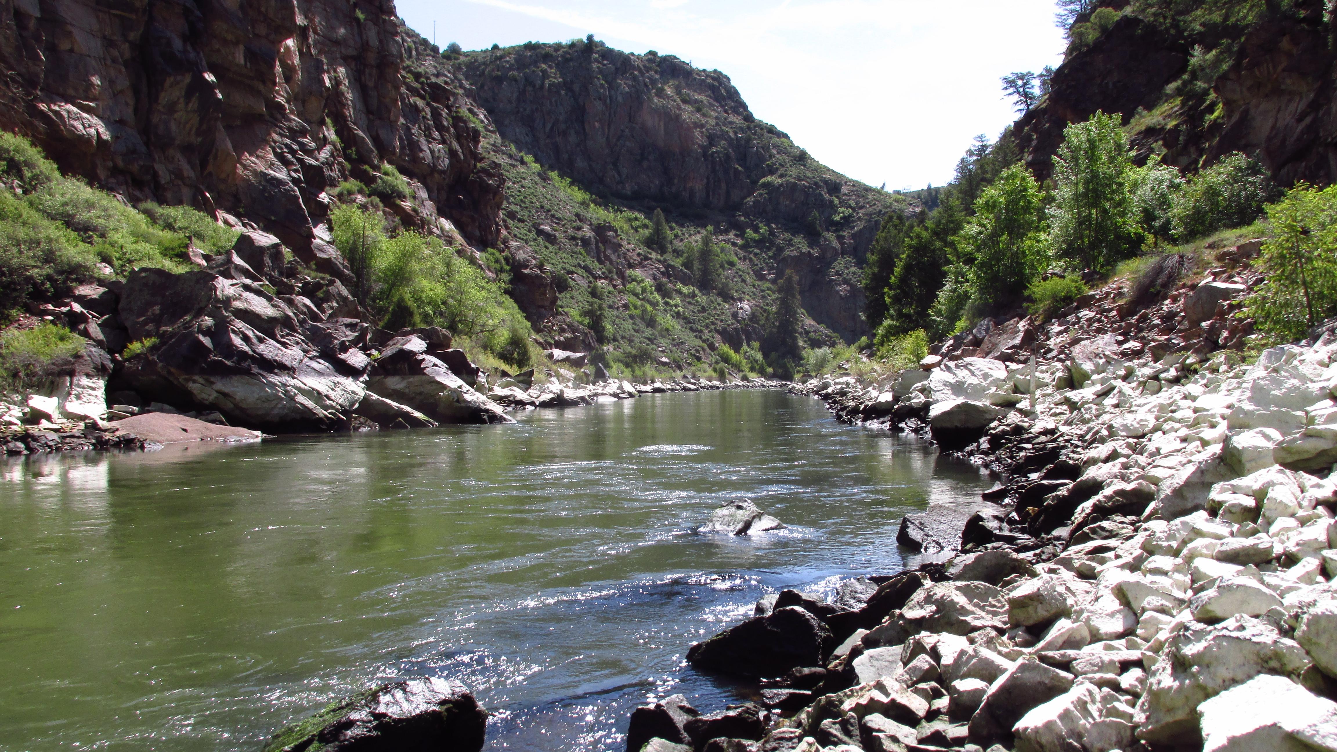 A narrow reservoir flowing between two canyon walls