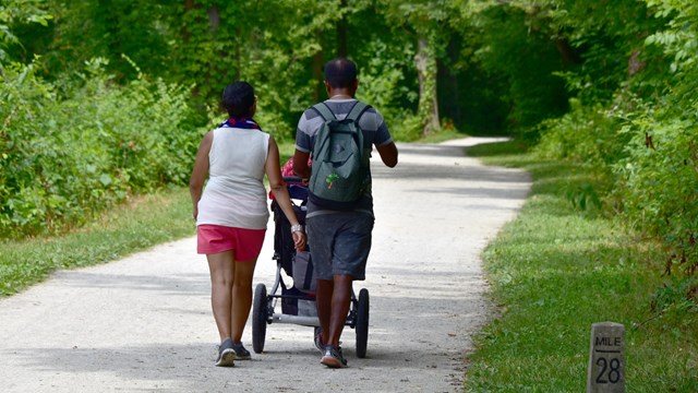 A family walks down the towpath.