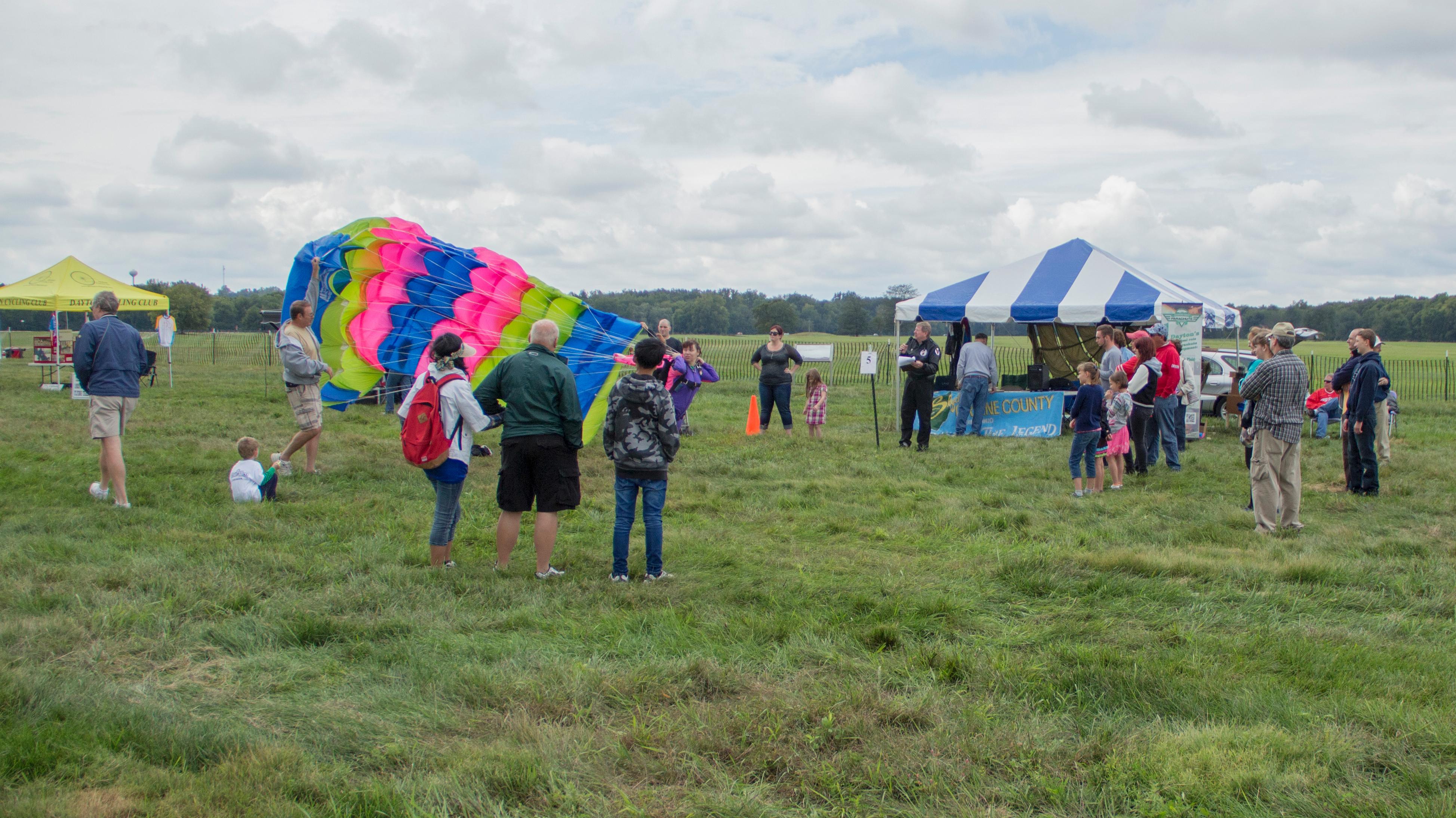 Visitors in a field during a park event