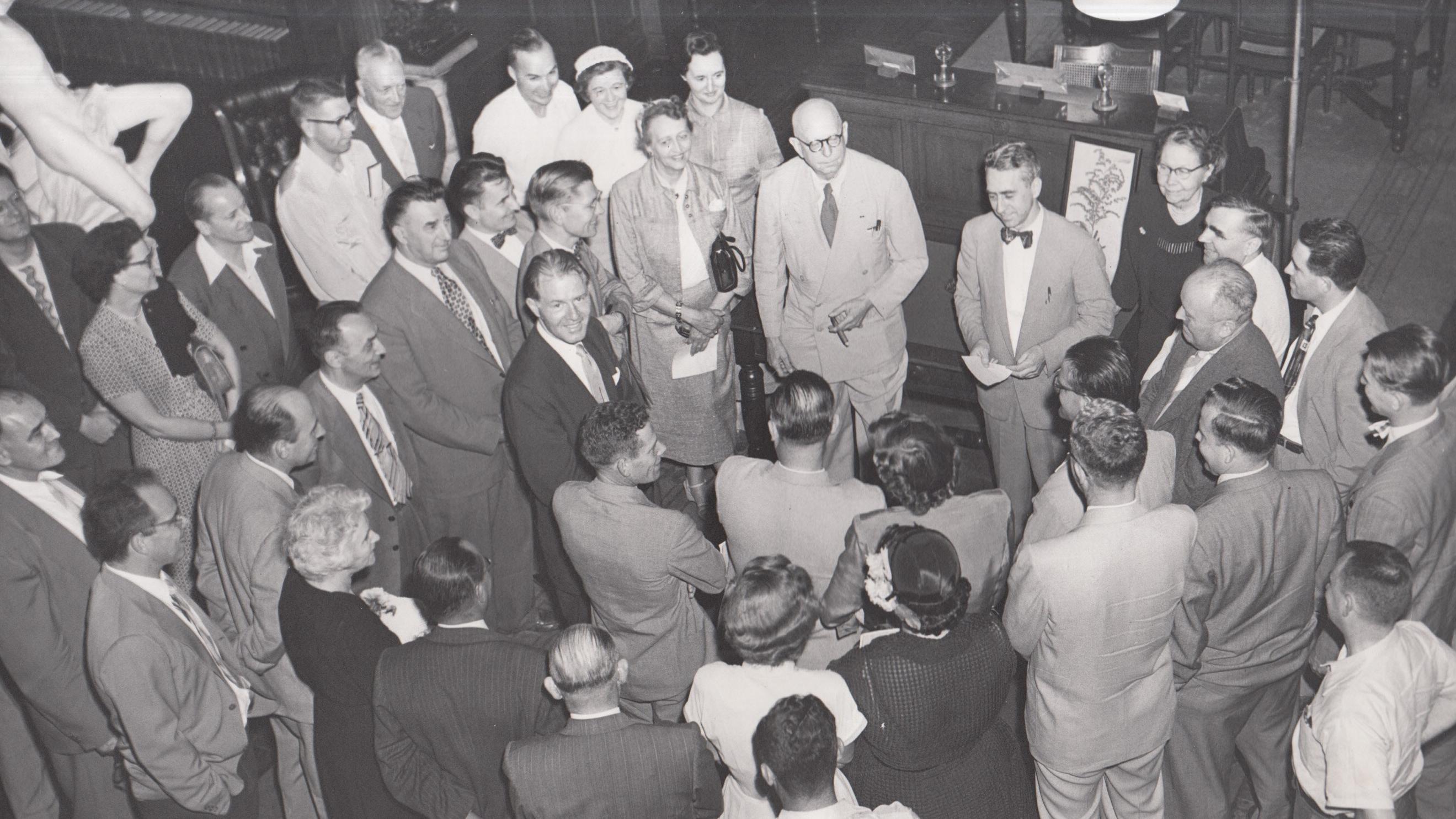 A large group of visitors in Edison's laboratory library