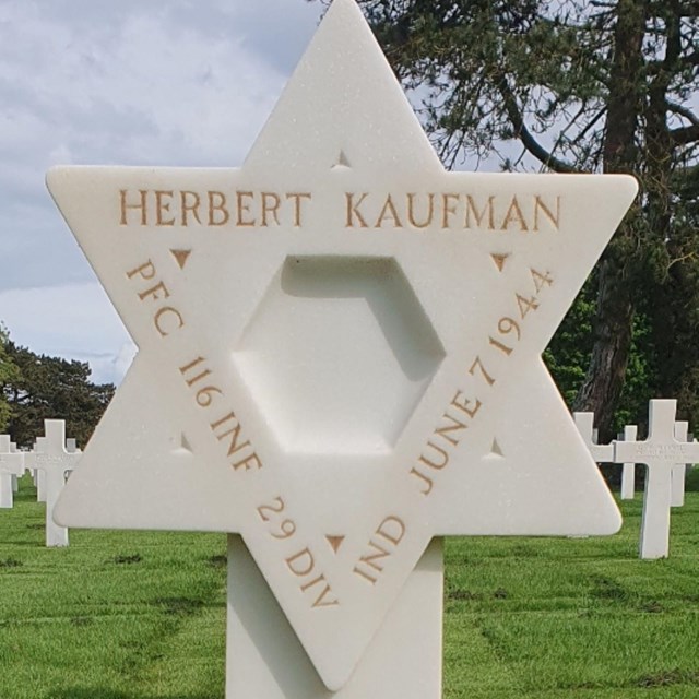A color image of a Star of David headstone for PFC Herbert Kaufman
