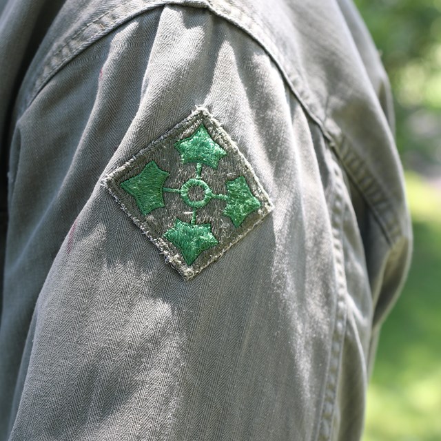A green 4th Infantry Division patch