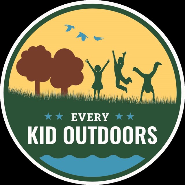 Logo for Every Kid Outdoors- graphic with cartoon kids in grass