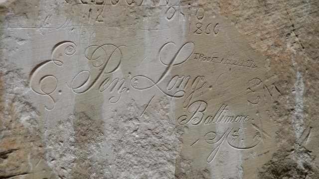 A calligraphy name inscribed on a rock