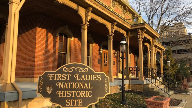 profile view of the Saxton House porch, with a sign that says First Ladies National Historic Site