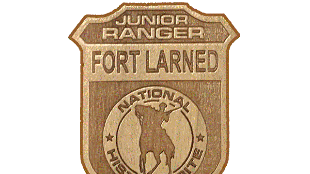 Cutout image of Fort Larned junior ranger badge.