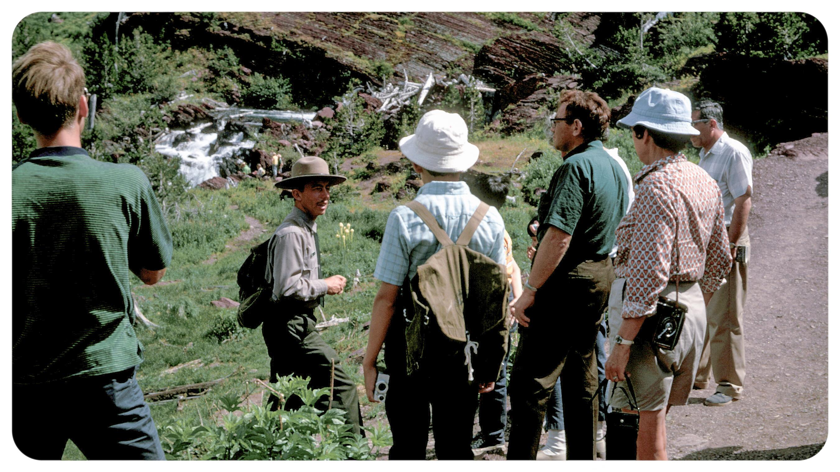a group of people with a ranger