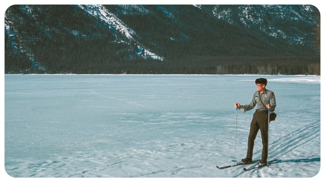 A person skis on a flat landscape