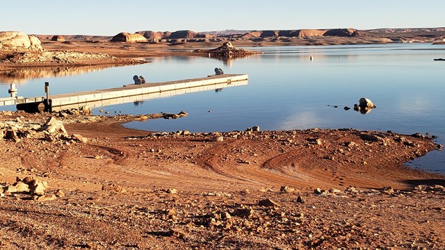 Empty dock on a desert lake.