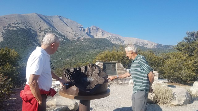 Park partners admiring a new exhibit donated to the park.