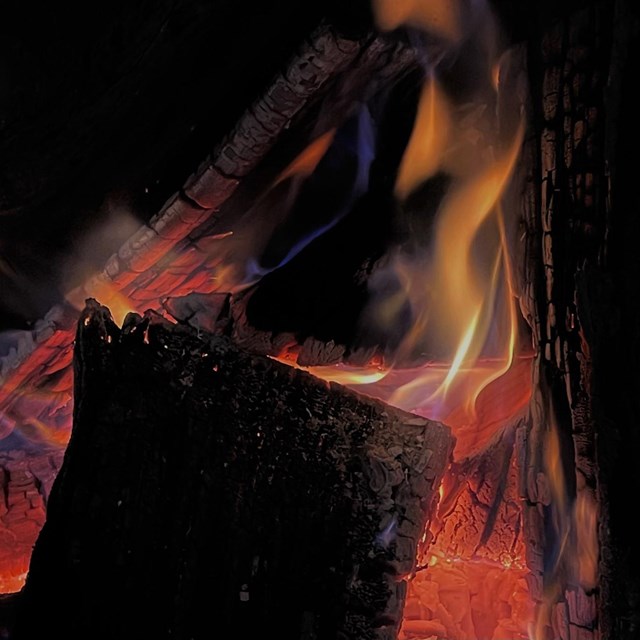 A group of logs burning.