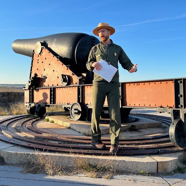 A ranger talks to visitors about park resources