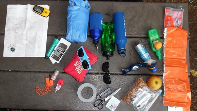 The ten essential items for hiking displayed on a table