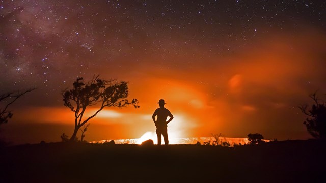 Shadow of ranger in front of volcano