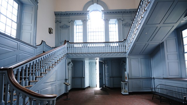 Color photo of the staircase in the south vestibule of Independence Hall.
