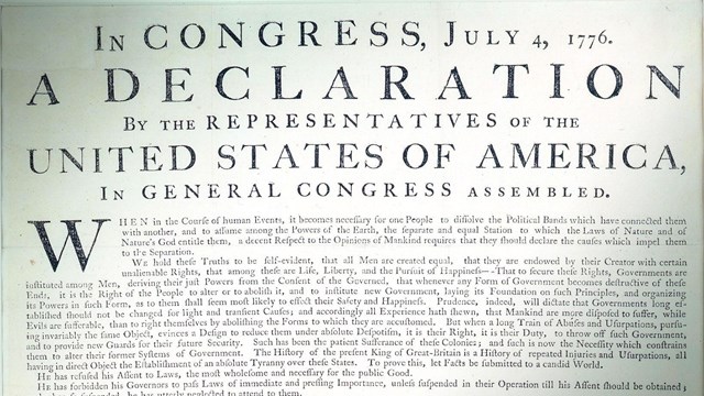 Color photo showing a detail of the Declaration of Independence printed document.