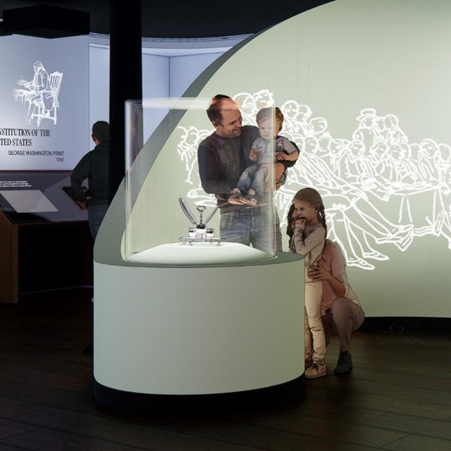 Artist's conception of the new exhibit case with silver inkstand.