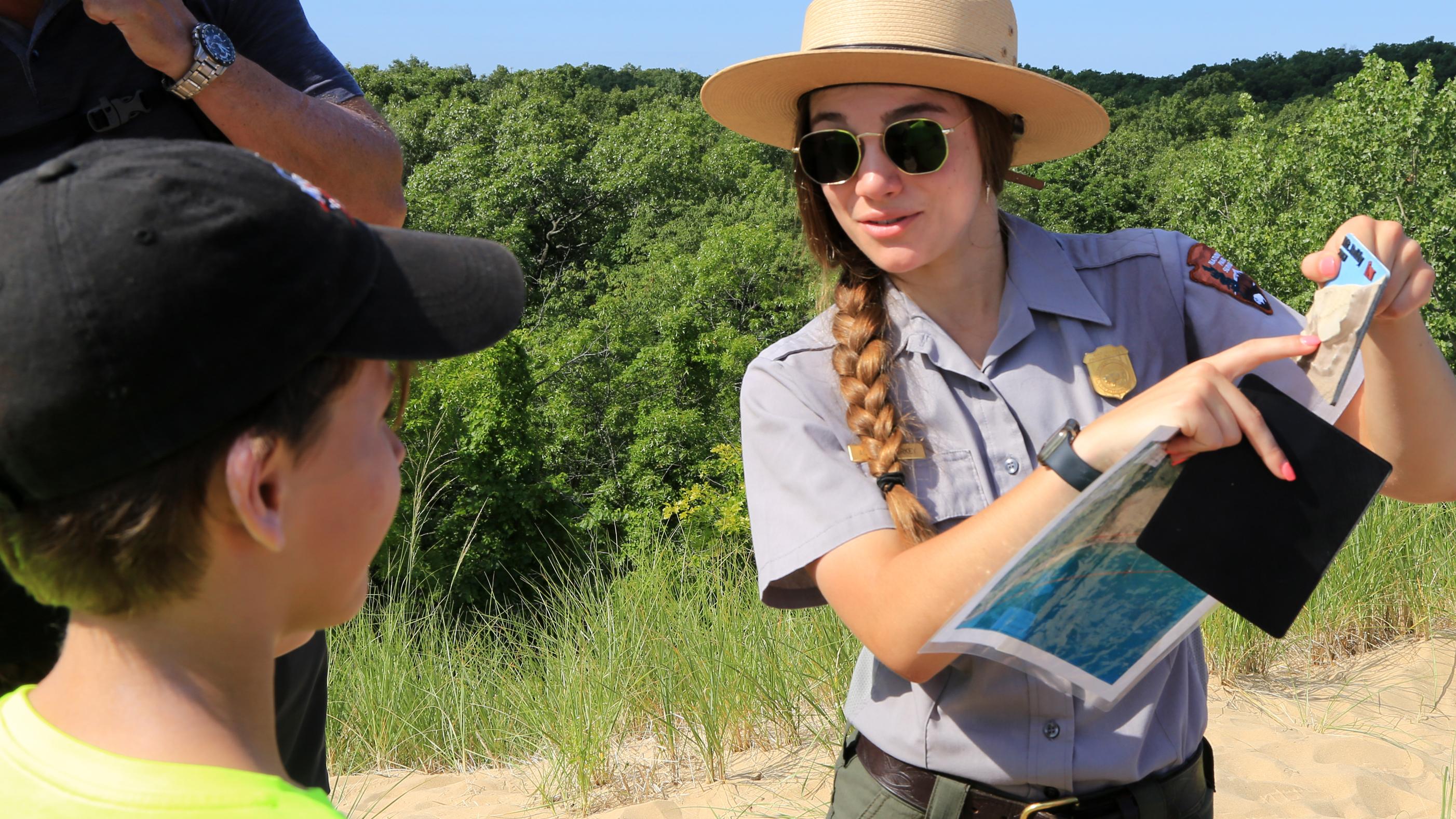 Interpretive park ranger teaching kids. Photo by Paul Kemiel.