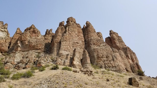 Chunky rock pinnacles rise up into the sky. 