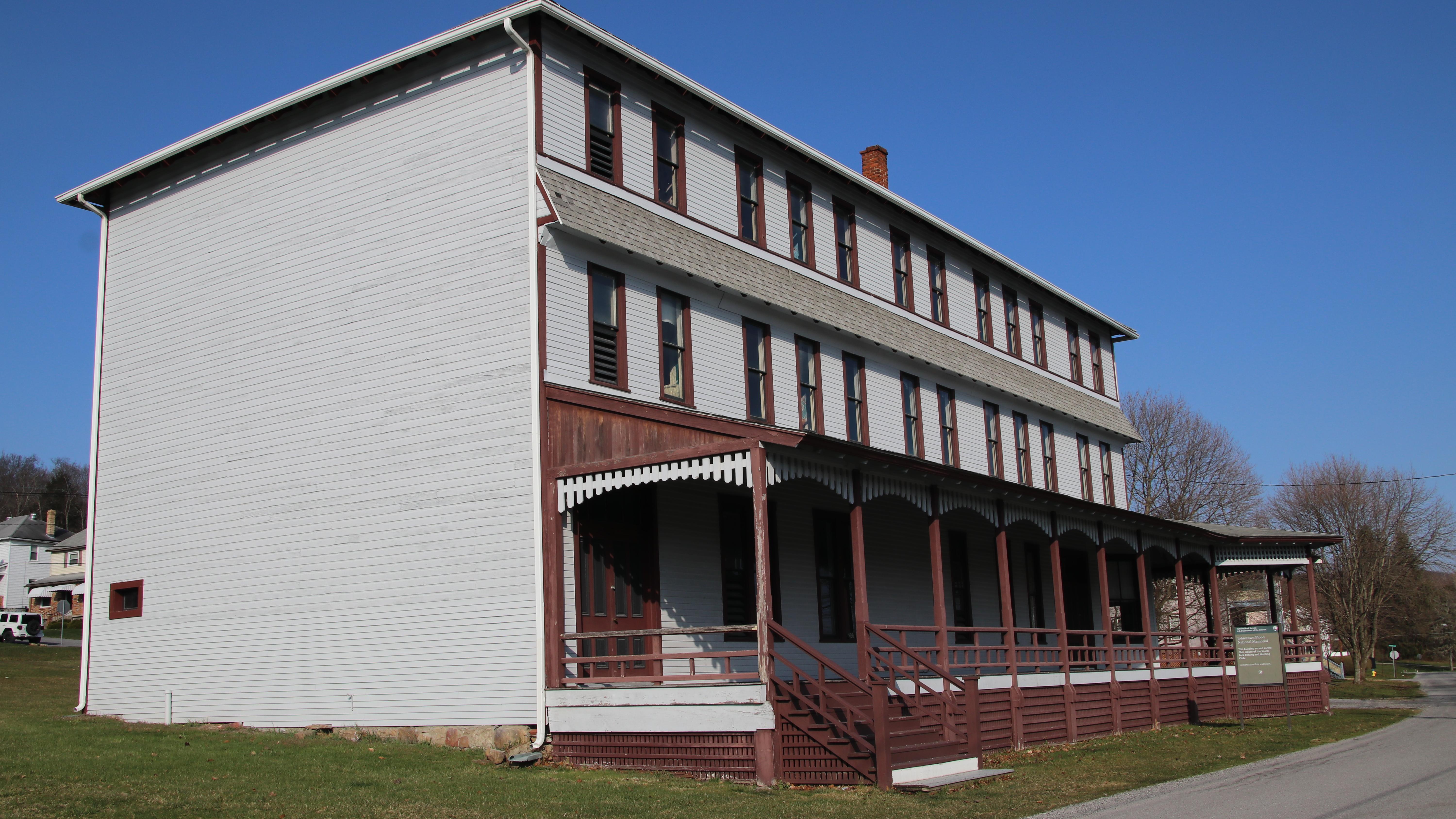 An angled view of a large 3 story building. 