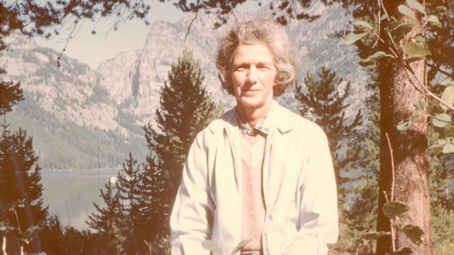 Picture of Mary Rockefeller at Jackson Hole, Wyoming. Background shows a lake and mountains.