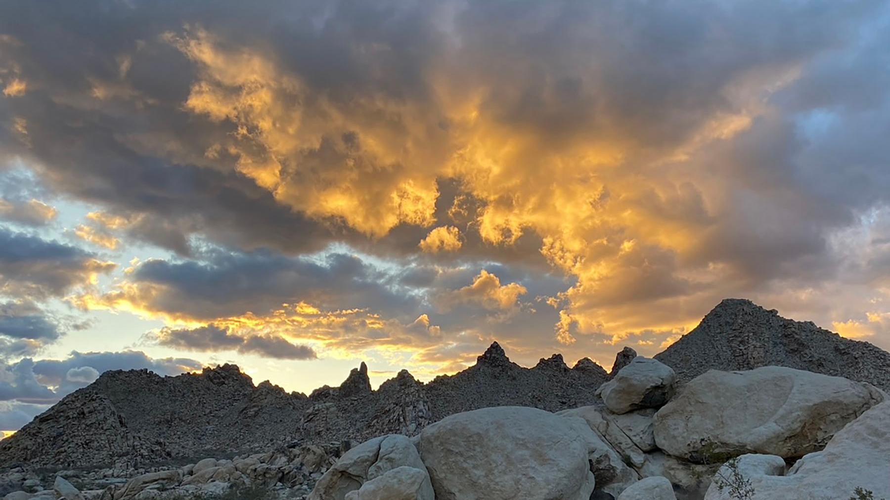 Mountains with orange clouds.