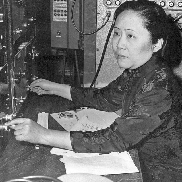 Historic image of Dr. Chien-Shiung Wu at a desk 