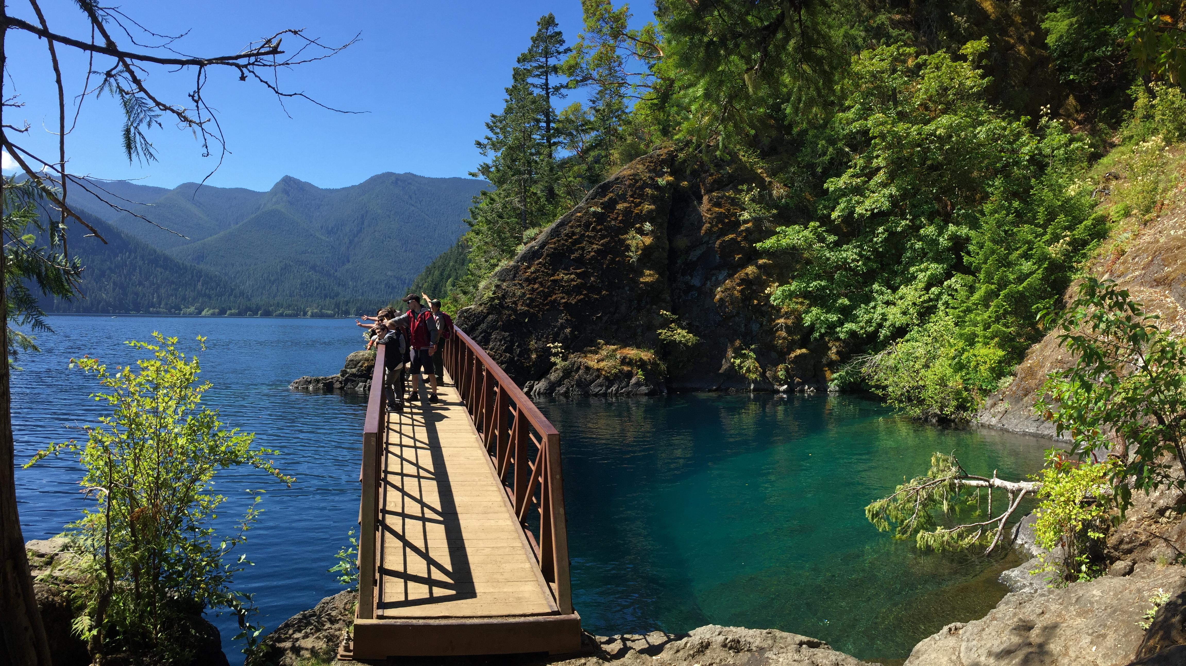 A metal footbridge over water on Lake Crescent