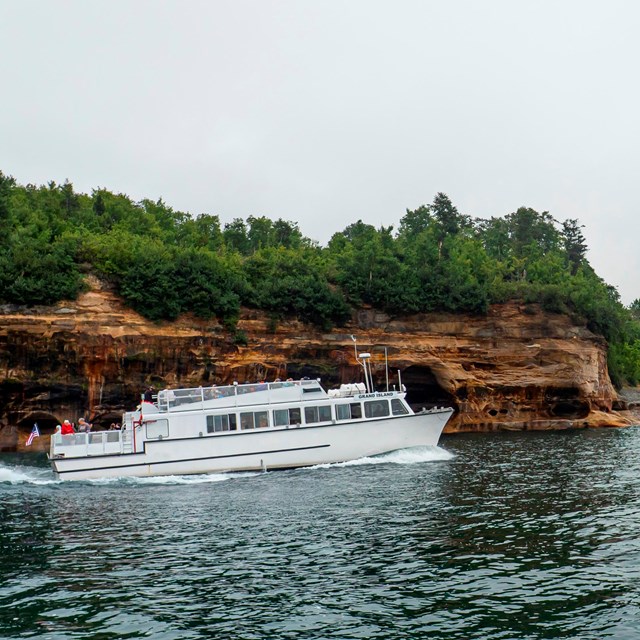 Boat cruise going along the Pictured Rocks Cliffs.