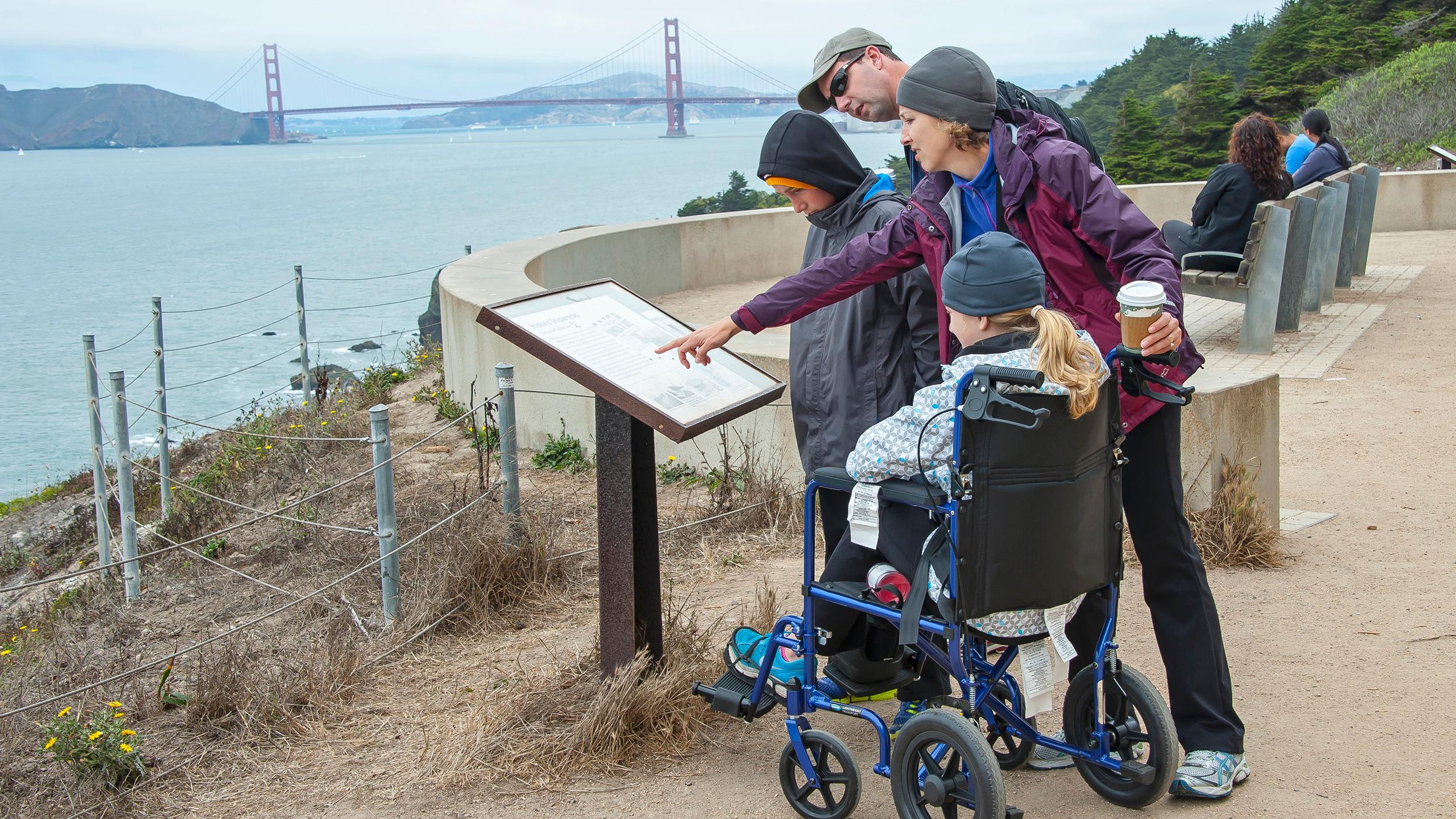 Park visitor using wheelchair accessible trail at Land's End