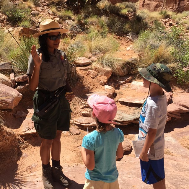 Ranger swears in two new Junior Rangers below Rainbow Bridge