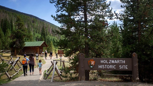 Hikers are walking down the Holzwarth Historic Site path