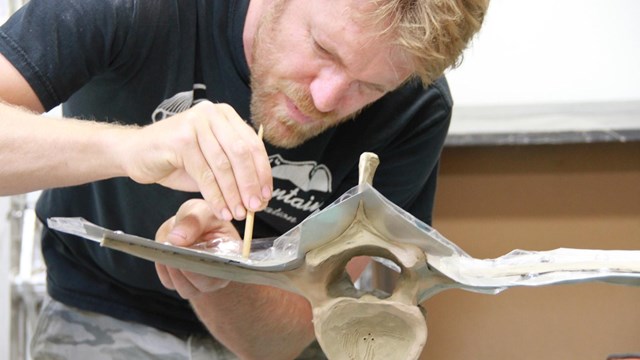 Artist Joe Norman is working on a sculpture