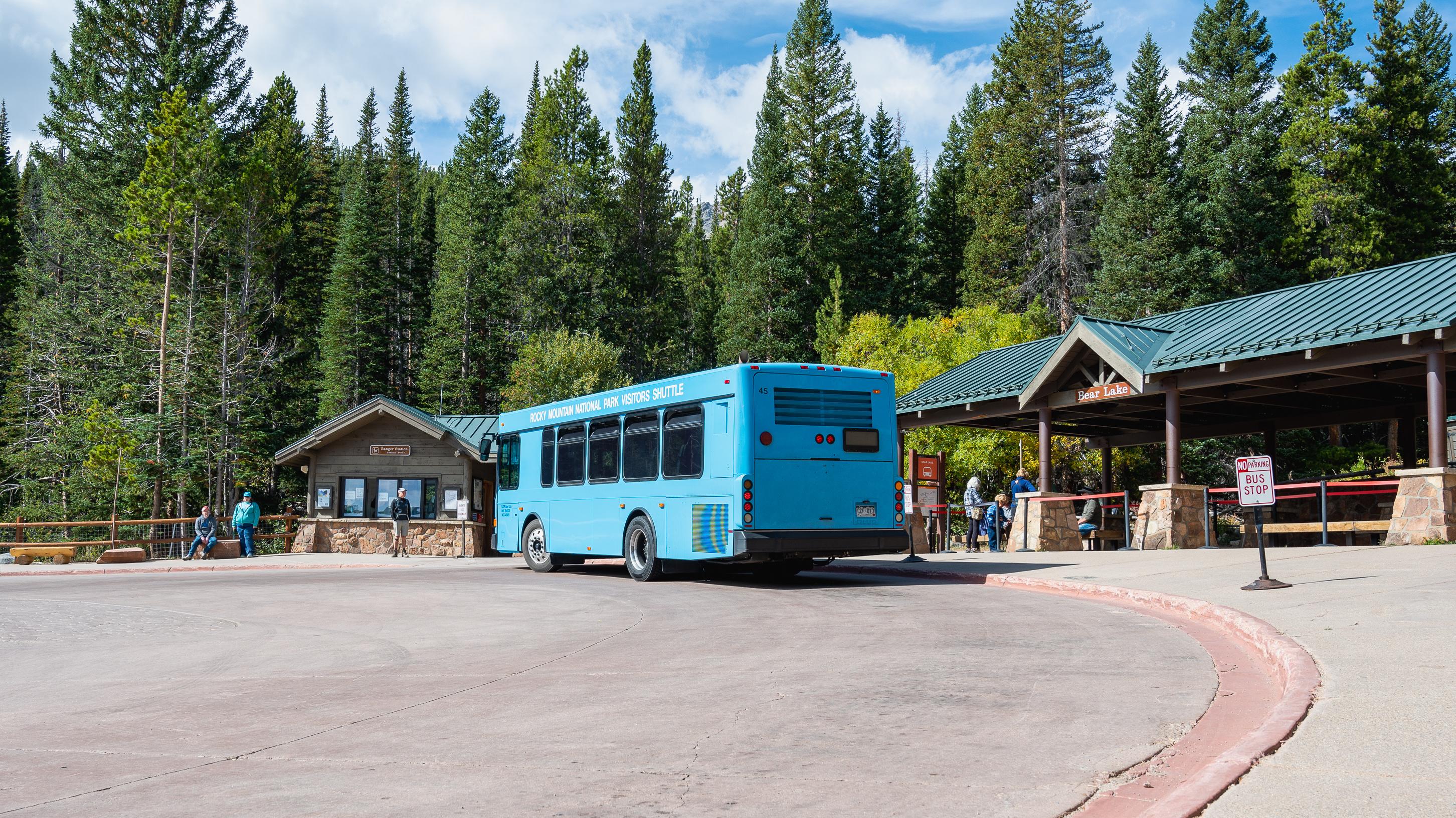 A shuttle bus is picking up passengers at Bear Lake