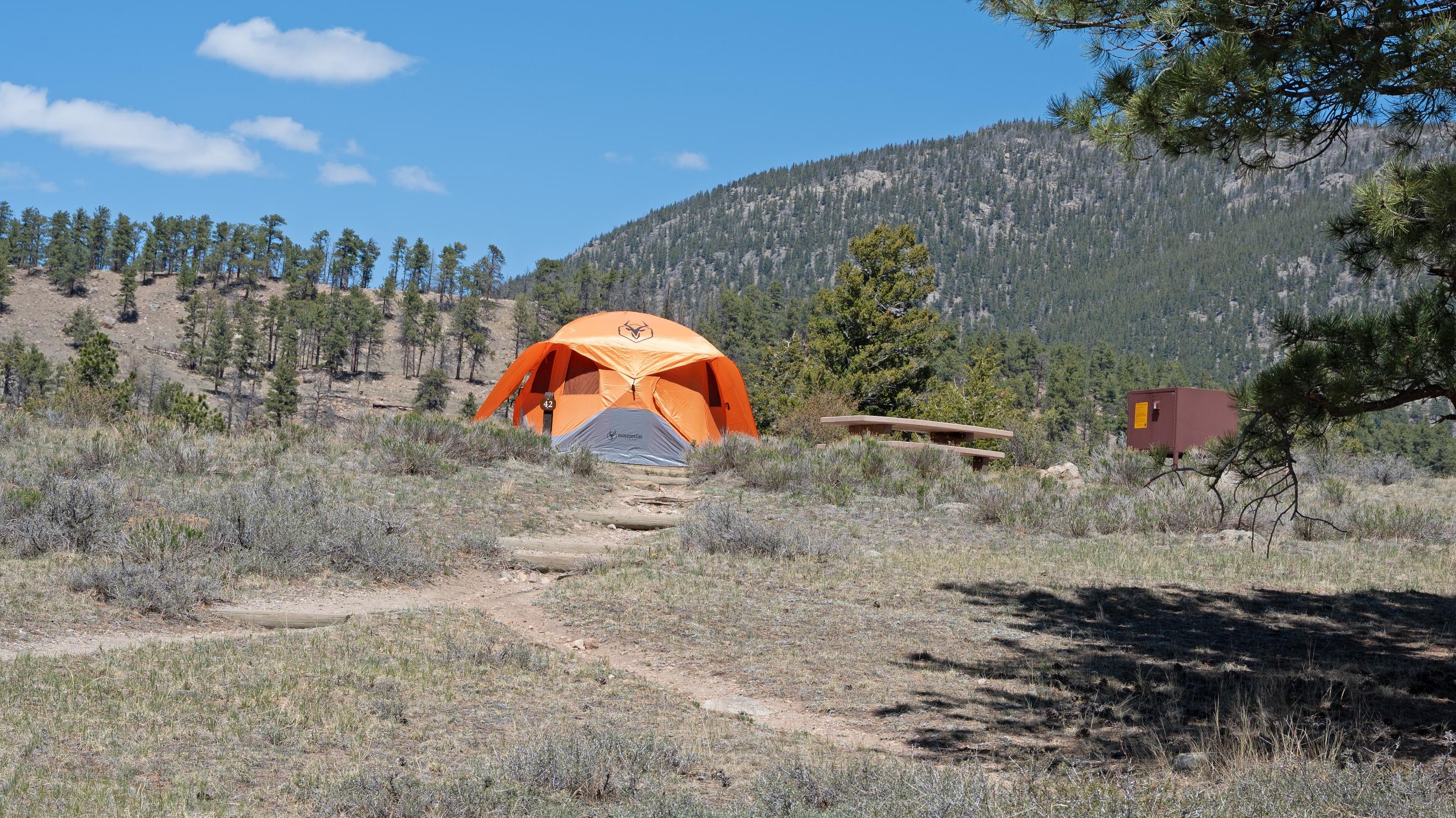 Standard non-electric site with a tent set up on a tent pad. 