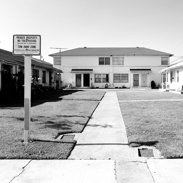 A courtyard with multiple housing buildings. 