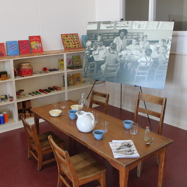 A modern display of a classroom with objects from the Maritime Child Development Center. 