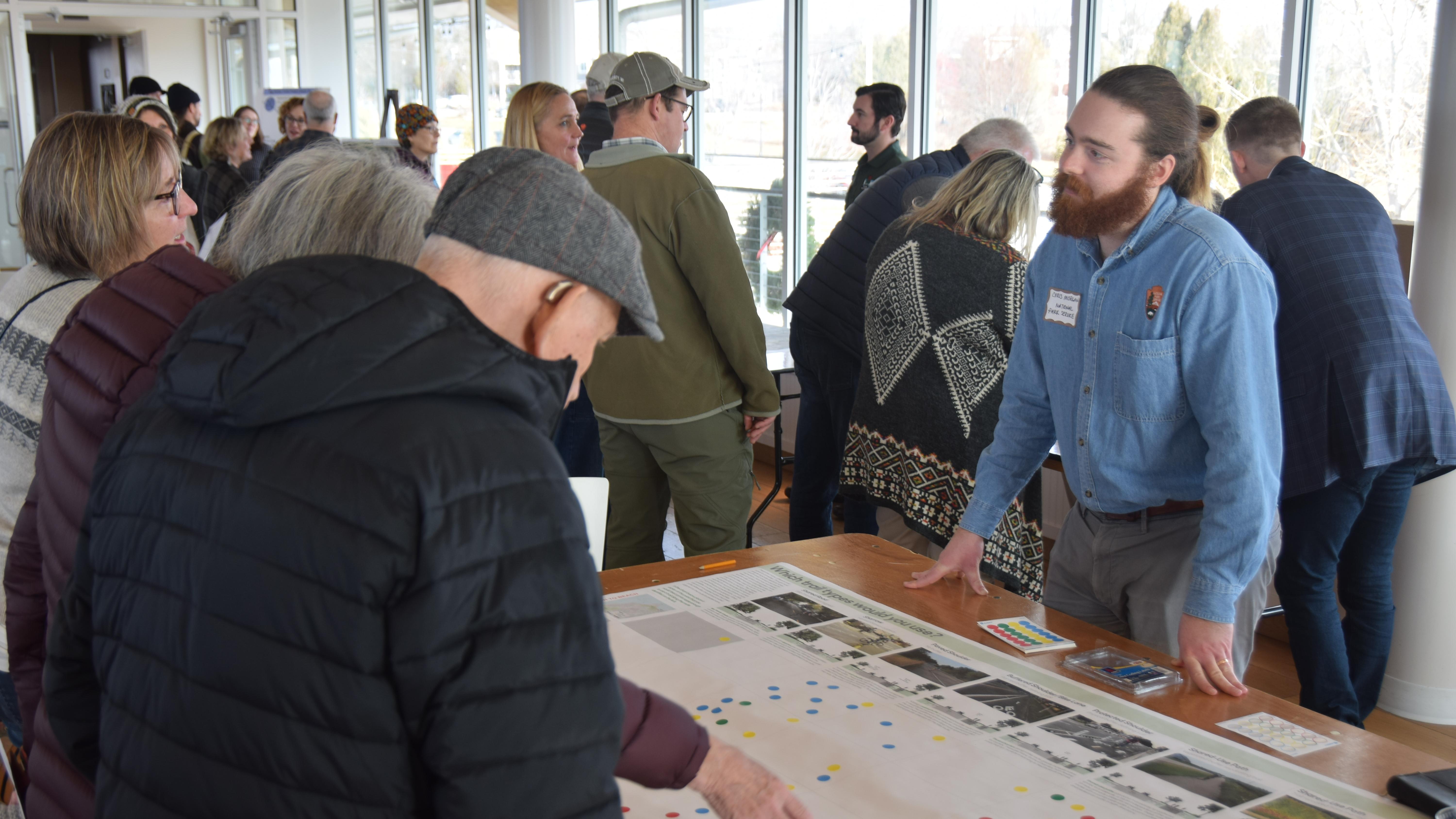An NPS employee at a community event