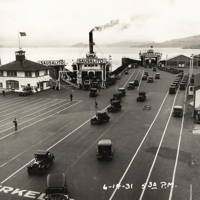 Historic photo of vehicles lines up on the Hyde Street Pier for the ferry to Sausalito and Berkeley