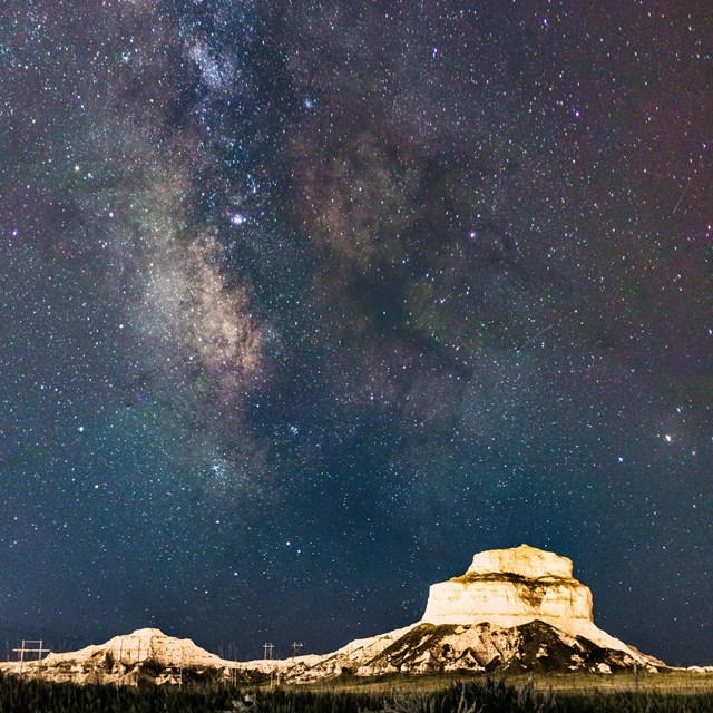 the milky way above a sandstone butte