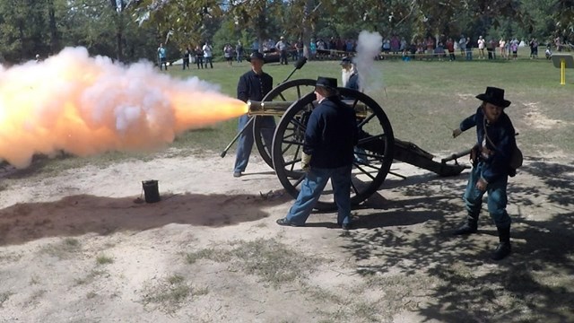 Living historians fire a cannon