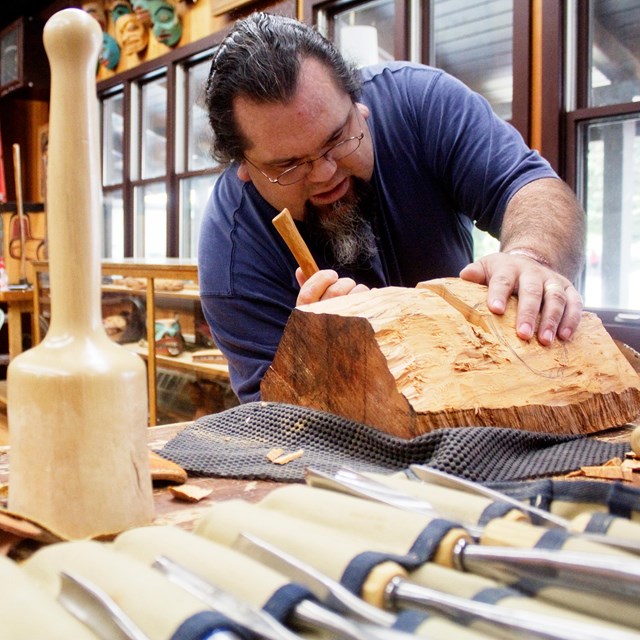 Man carving wood