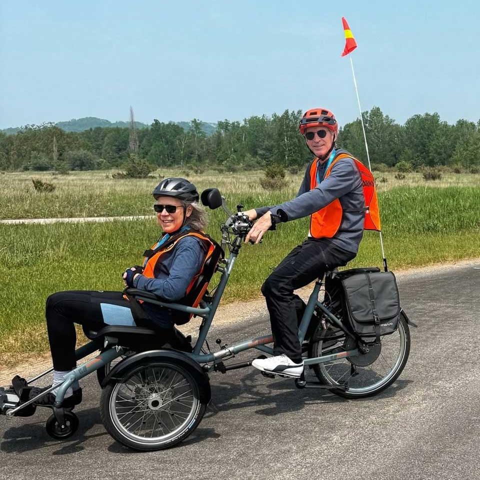two people sit on an adaptive hike