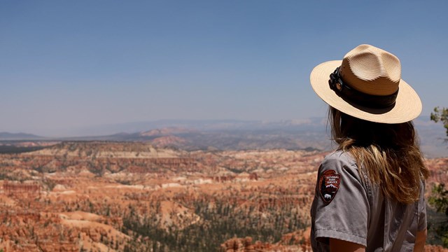 a park ranger overlooks Bryce Canyon rock formations