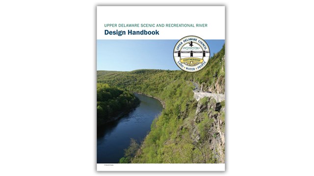 Cover of UDC Handbook: photo of river view with UDC logo in corner