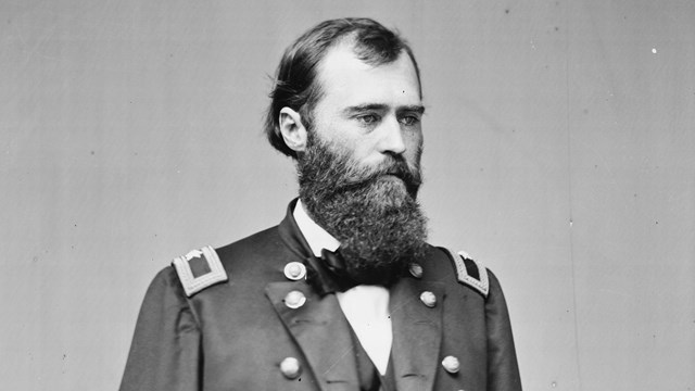 A black and white image of Eugene Carr standing in Union generals uniform.